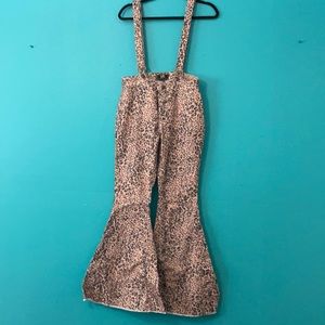 Cheetah print, flare bottom overalls.